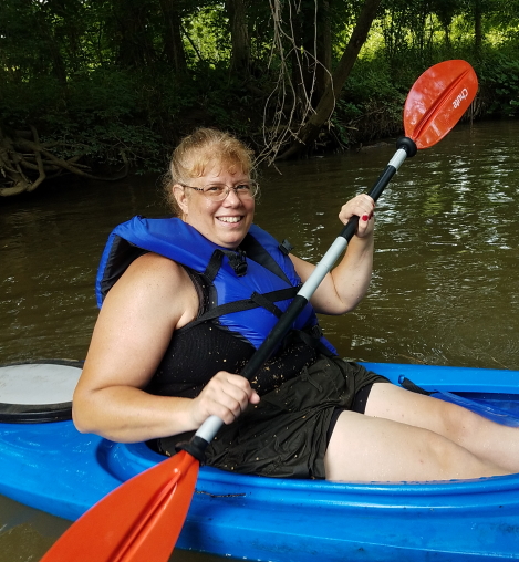 Cathy Koning paddles a kayak