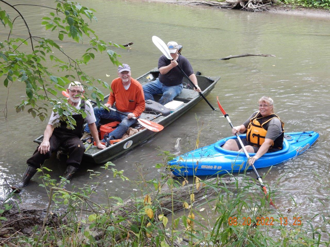 River Cleanup volunteers in boat and kayak